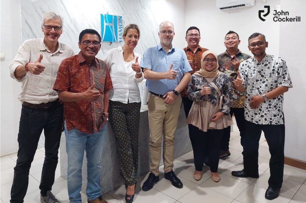 eight people happy in indonesian office of John Cockerill Hamon