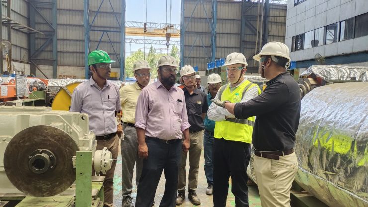 people visiting an Indian manufacturing plant