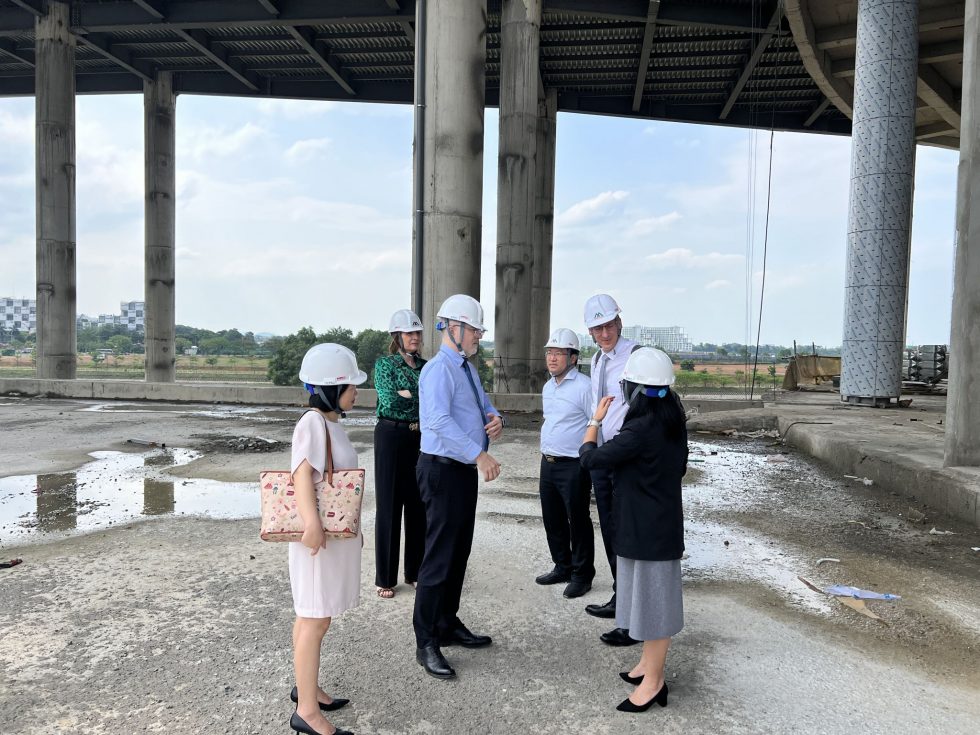 six people discussing on a work site