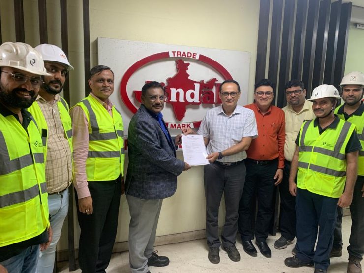 indian people and workers presenting an official final acceptance document in Jindal office for cold rolling mill and color coating line